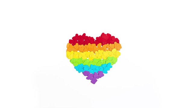 Stop motion animation of paper heart with rainbow color stripes symbol of LGBT gay Pride. Love, diversity, tolerance, equality concept
