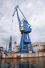 Blue port crane, close-up vertical photo, Varna