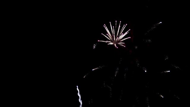 Fireworks Flashing in the Night Sky. Slow Motion in 96 fps. Real Fireworks with smoke. Collage of colorful fireworks exploding in the night sky. Carnival Nice massive fireworks, fire in the sky. Full
