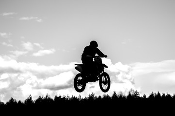 Fototapeta na wymiar Silhouette Of Motocross Rider. Black and white