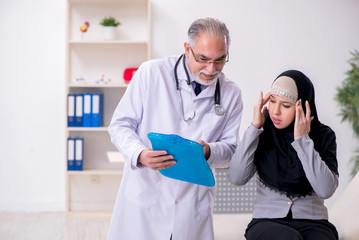 Arab woman visiting experienced doctor