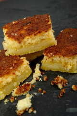 Pieces of creamy cornmeal cake. Traditional Brazilian treats made of corn