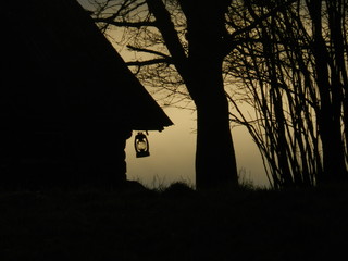 A silhouette of old farm cabin built in the early 1950’s