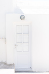 white door in santorini