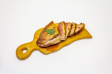 Roasted duck breasts and spices isolated on white background