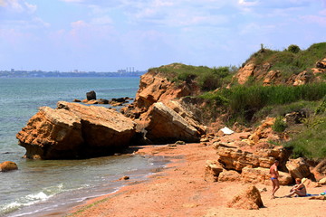 Beautiful wild Beach Fontanka  near Odessa. Yellow and red sandstone cliffs are located on the seafront. Sunny day