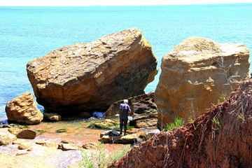 Beautiful wild Beach Fontanka  near Odessa. Yellow and red sandstone cliffs are located on the seafront. Sunny day