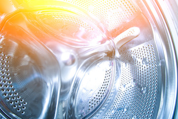 inside the drum of the washing machine. Steel drum open. Closeup. washing machine drum background...