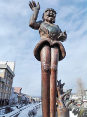 strange statue at the bridge across Miyagawa river, in Takayama Japan