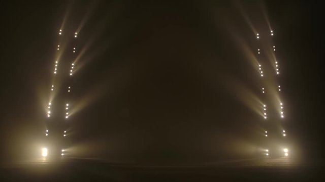 Stage with spot lighting, shining empty scene for holiday show, award Ceremony or advertising on the gold spotlight Background.