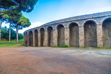 Obraz premium Pompeii in Italy, ruins of the antique Temple of Apollo with bronze Apollo statue, Naples.