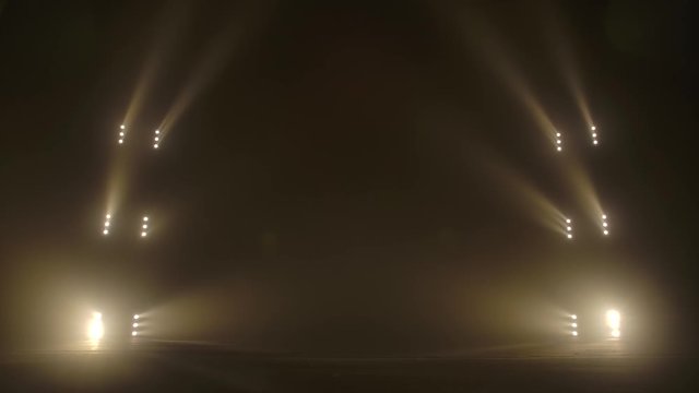 Stage with spot lighting, shining empty scene for holiday show, award Ceremony or advertising on the gold spotlight Background.