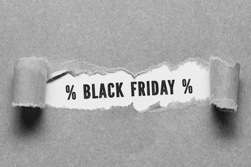 torn paper reveals BLACK FRIDAY on white background