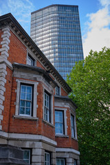 Obraz premium Looking up to modern Millbank Tower with older building in foreground