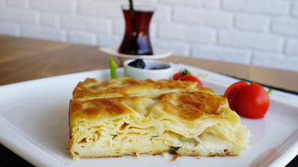 turkish pastry on breakfast plate with tea