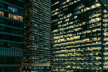 Fototapeta na wymiar Facade of a big office building at getting night