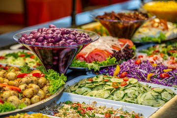 Delicious restaurant salad buffet. With blurred background