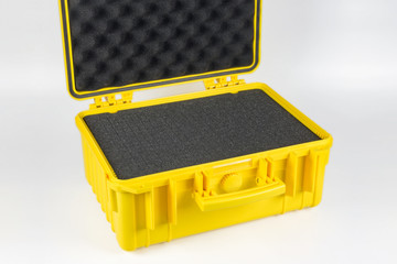 Yellow plastic protective case for the camera against a white background.