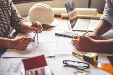Team of engineers working together in a architect office. © photobyphotoboy