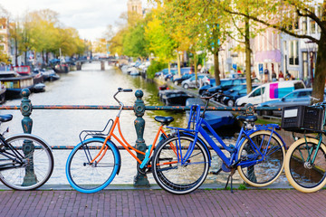 Fototapeta na wymiar colorful bicycle on a canal bridge in Amsterdam