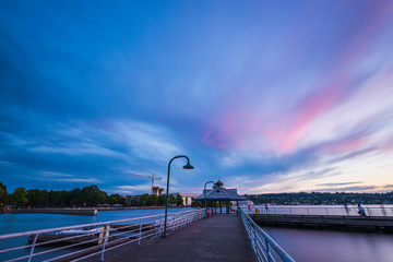 scene of walk way on the lake when sunset.