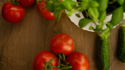 
Vegetables. Tomatoes and cucumbers with basil. Ready free entry space