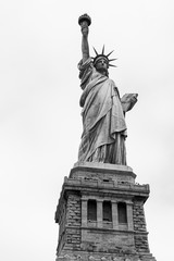 Fototapeta premium Statue of Liberty In New York Against A White Sky