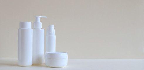 Cosmetic products for face and body in containers without labels. The concept of Spa skin care and body.