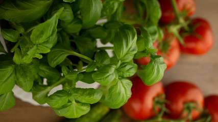
Vegetables. Tomatoes and cucumbers with basil. Ready free entry space