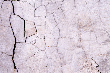 Cracked concrete texture. Faults and cracks on the stone surface.