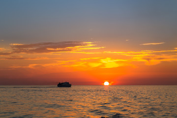 Orange sunset in sea from the coast of Sicily.