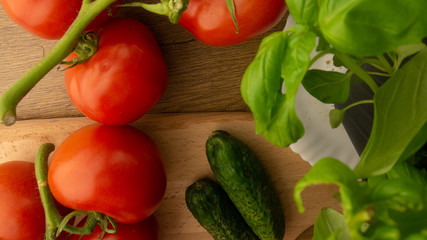 
Vegetables. Tomatoes and cucumbers with basil. Ready free entry space