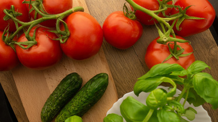 
Vegetables. Tomatoes and cucumbers with basil. Ready free entry space
