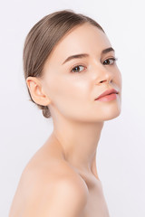 Fototapeta premium Beauty Woman face Portrait, Beautiful Young Woman with Clean Fresh Healthy Skin, Facial treatment. Cosmetology, beauty and spa, isolated on white background.