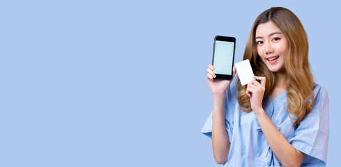Naklejka premium big success sale package promotion exited asian causal lifestyle female hand gesture present credit card and smartphone big surprise promotion event with blue color background
