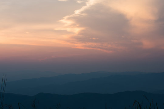 The sky and the mountains alternate after the sun sets.