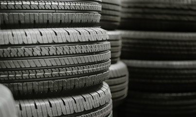 Pile of tires stack in warehouse waiting to transport to distributors, new car tyres product in manufacturing factory background © ZETHA_WORK