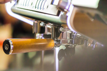 Espresso Machine pouring fresh coffee into cups at Local Coffee Shop..