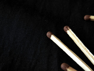 Still life with a matchbox scattered in the dark