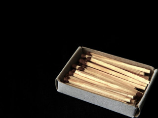 Still life with a matchbox scattered in the dark