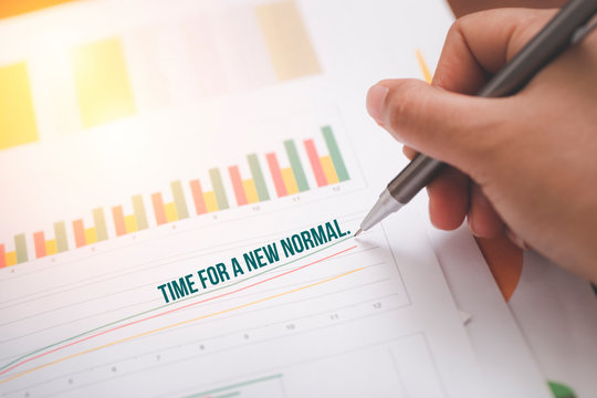 Business pen pointing with text "TIME FOR A NEW NOTMAL" analyzing report success.