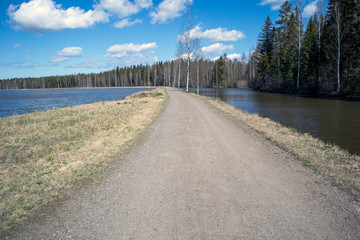 Obraz premium narrow dirt road by the Saimaa canal, Lappeenranta Finland