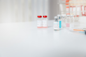 Sample of coronavirus vaccine (COVID-19) on work table in a medical lab.