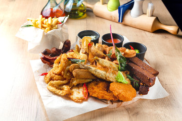 Beer snack, onion rings, croutons, sauce