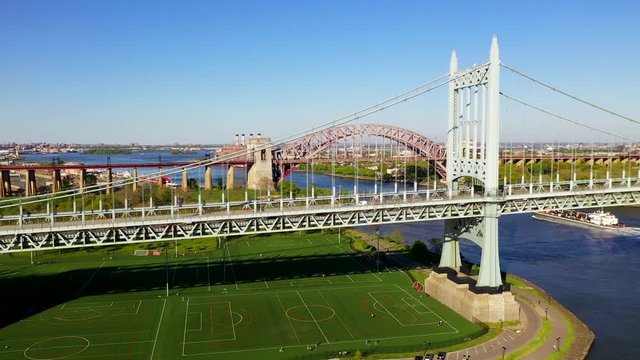 Aerial Crane Shot of the RFK and the Hell Gate Bridge Over the East River