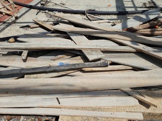 Pile of wood debris at a shop building demolition site, Construction waste on the restaurant floor
