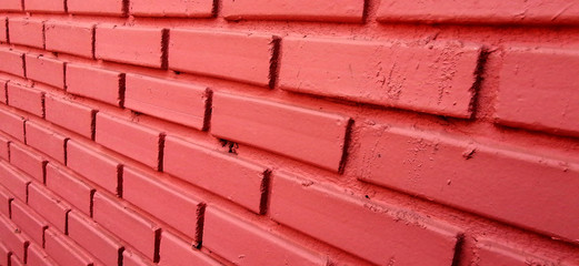 The school's wall surface is made of bricks.