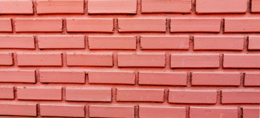 The school's wall surface is made of bricks.