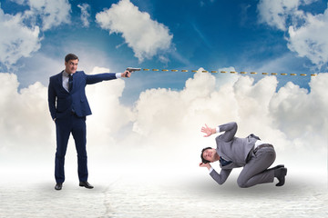 Businessman with gun threatening his competitor