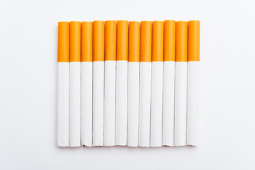 31 May of World No Tobacco Day, no smoking, close up of lined up full pile cigarette or tobacco on white background with copy space, and Warning lung health concept